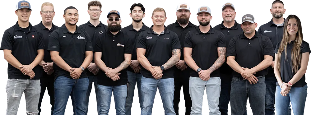 Professional team photo of diverse group wearing matching black polo shirts and jeans