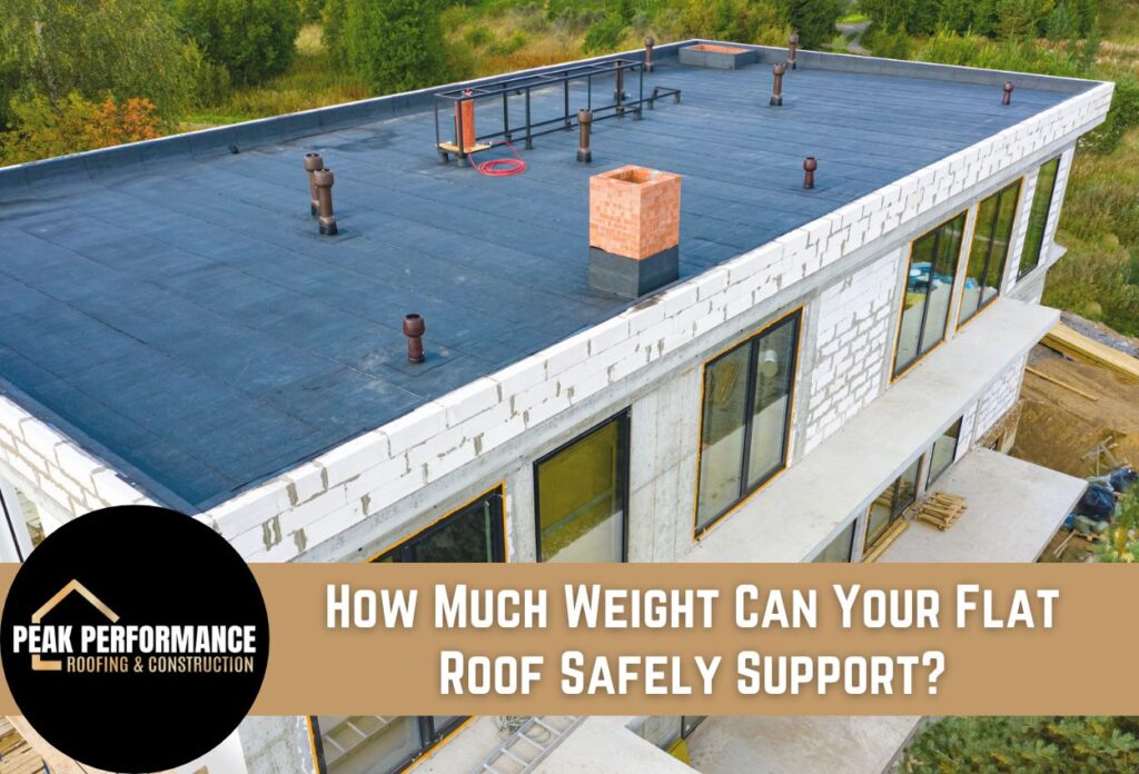 Modern flat roof construction with blue membrane, brick chimney, and white walls