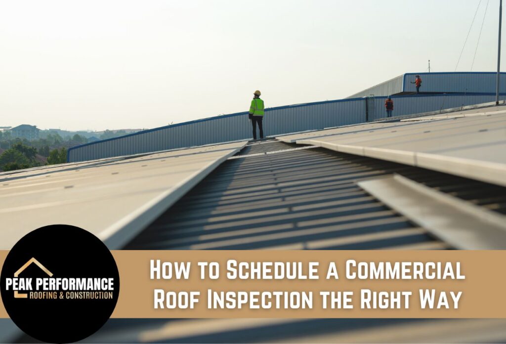 Worker inspecting a commercial roof under clear sky conditions.